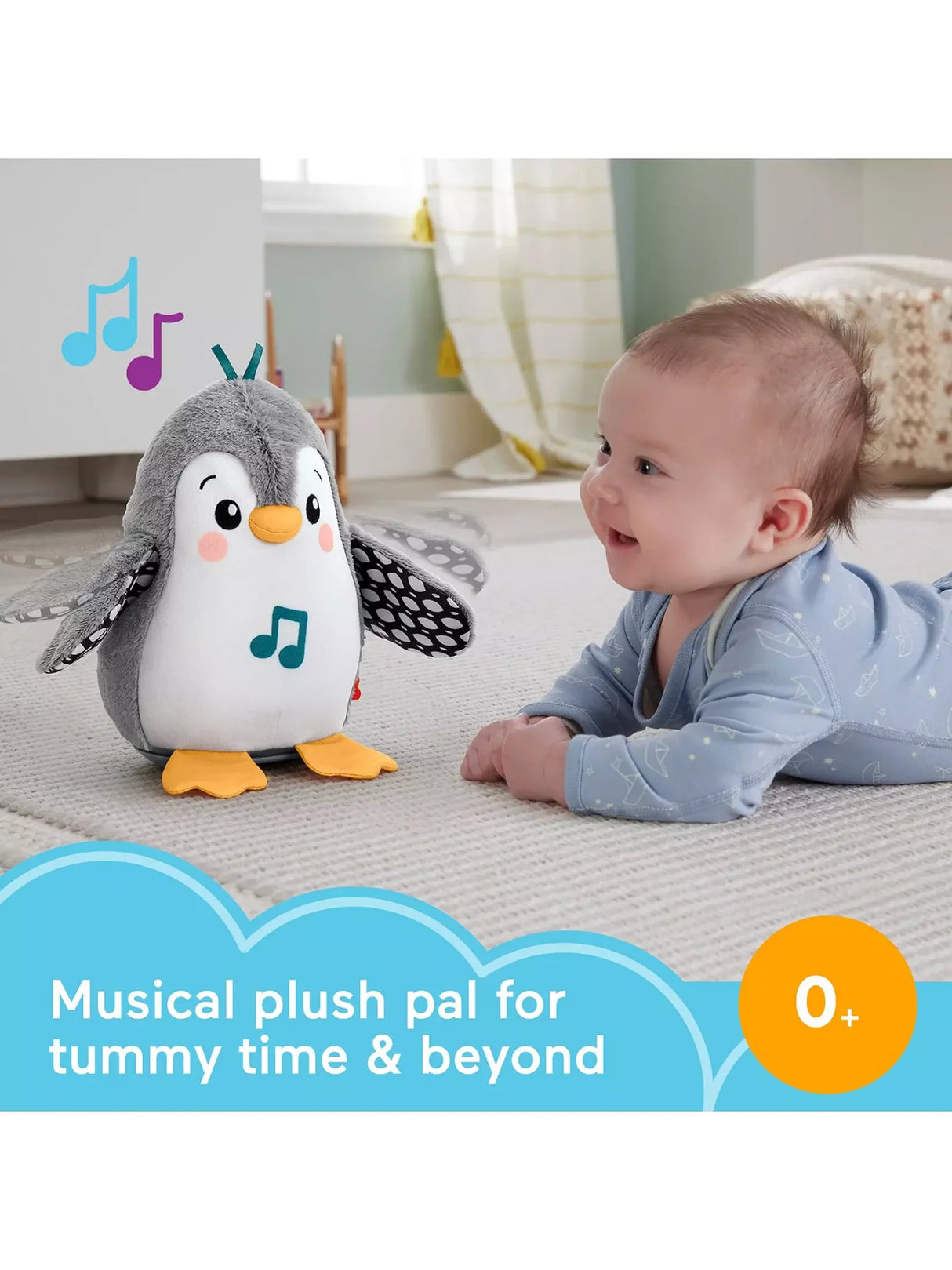 Baby on tummy reaching toward Fisher Price Flap & Wobble Penguin with flapping wings and lights