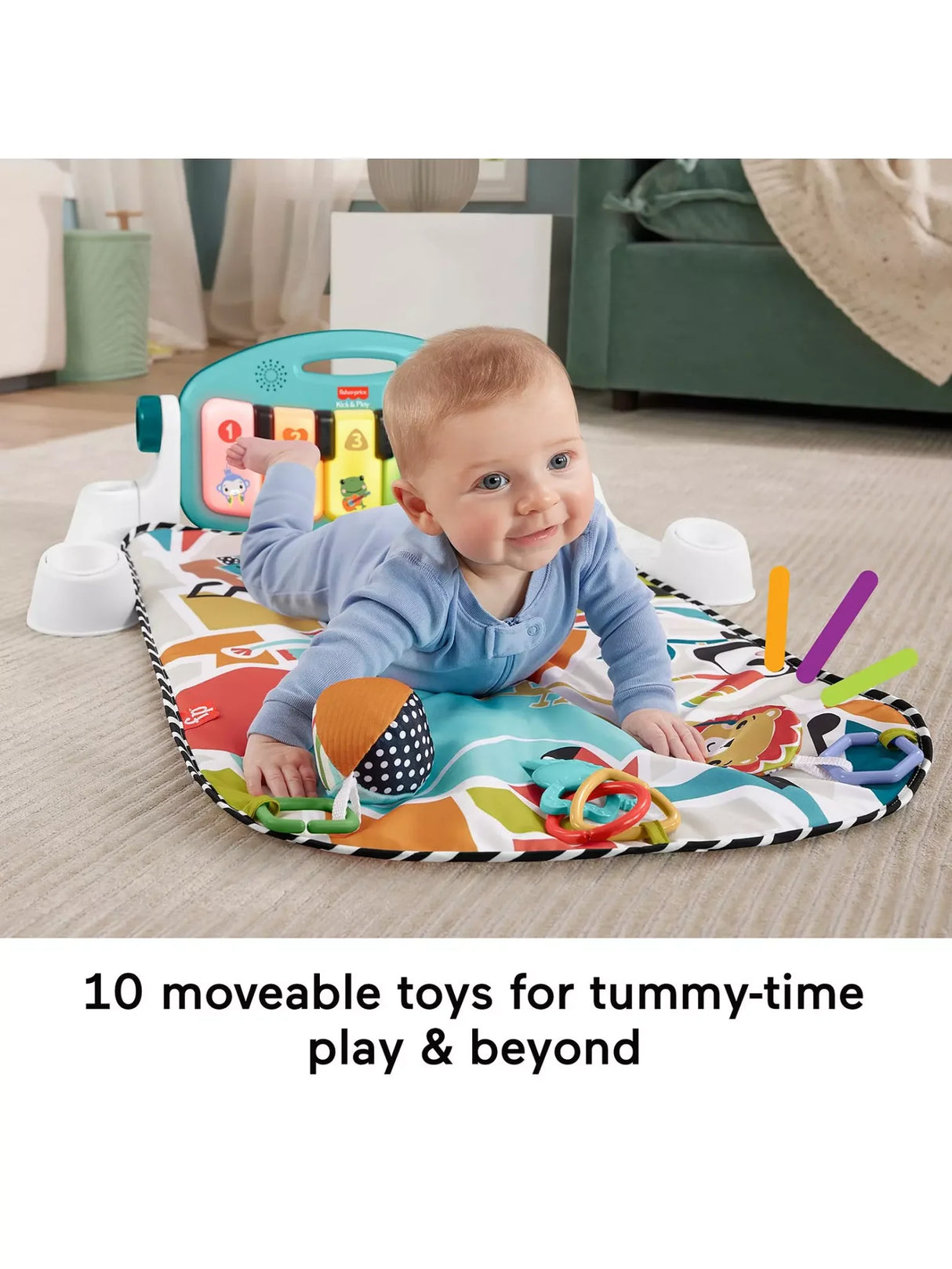Baby enjoying tummy time on blue Fisher Price Glow and Grow Kick and Play Activity Gym