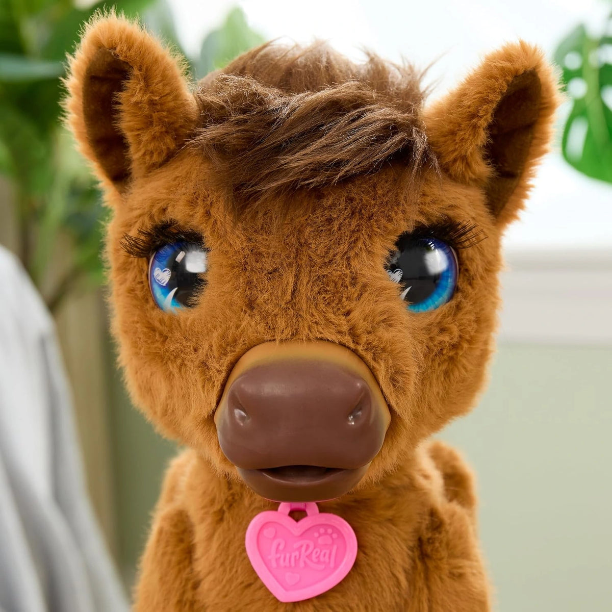 FurReal Penny Feed & Prance Pony close up showing blue eyes and pink heart tag