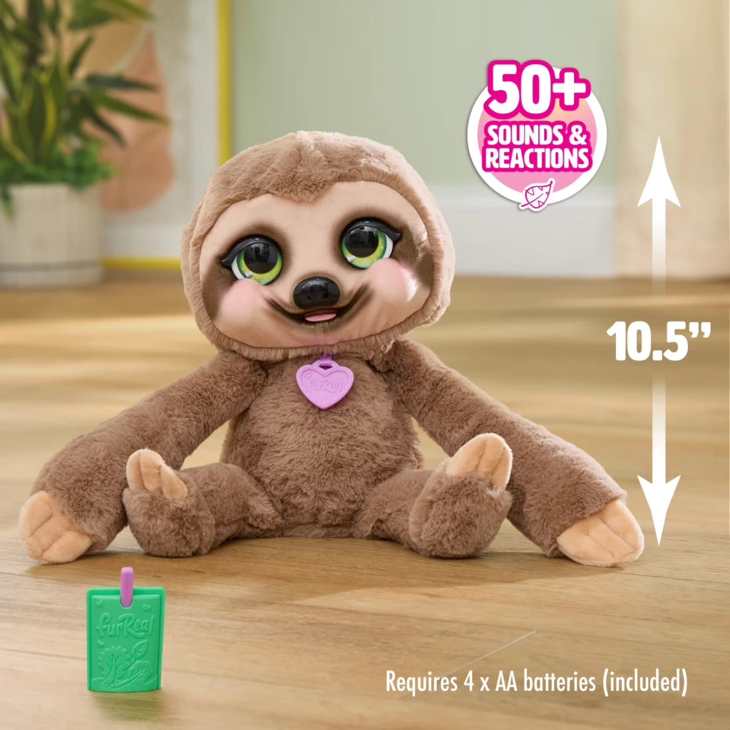 FurReal Snuggles the Smiling Sloth seated beside 10.5 inch height marker and green juice pouch