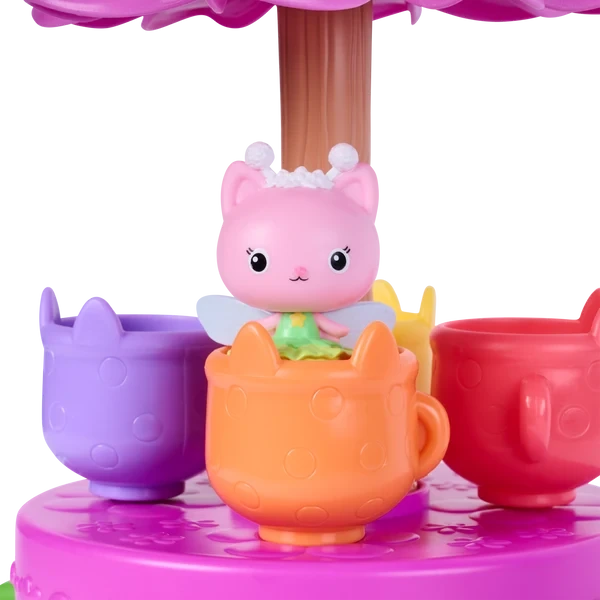 Gabby's Dollhouse Fairylandia Flutter-riffic Tea Party Playset with pink tea party decorations.
