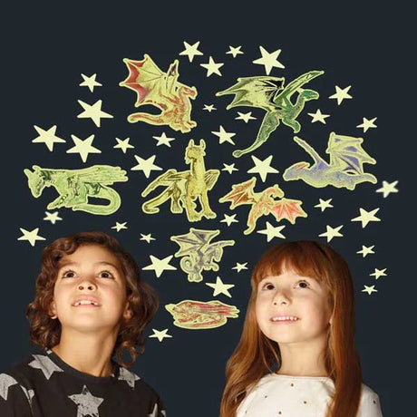 Two children enjoying the Glow in the Dark Stars and Dragons stickers displayed on bedroom wall glowing at night