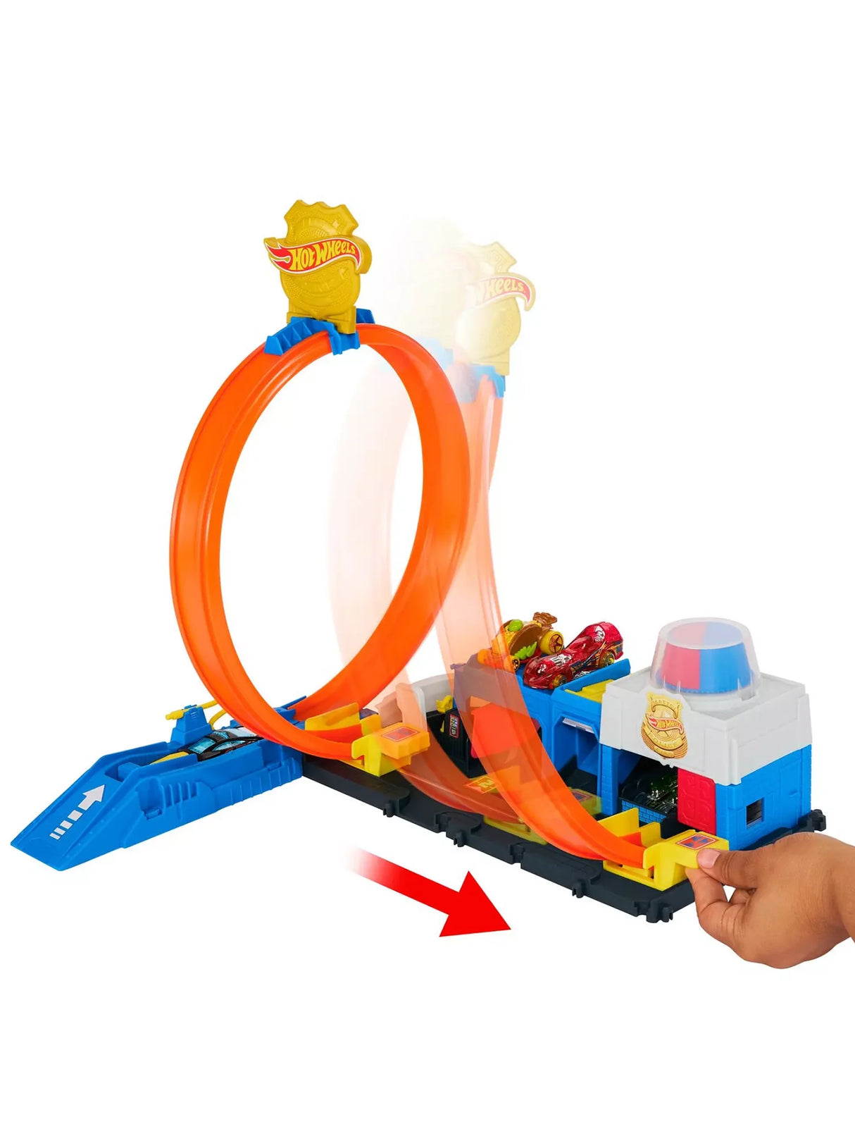 Hot Wheels City Super Police Station Playset with car racing through orange loop during play.