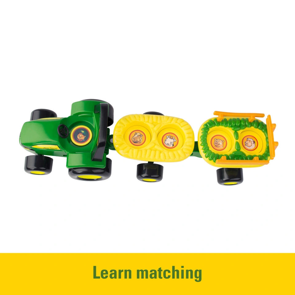 Top view of John Deere tractor and two wagons showing circular matching picture spaces inside the trailers, with yellow banner text “Learn matching”
