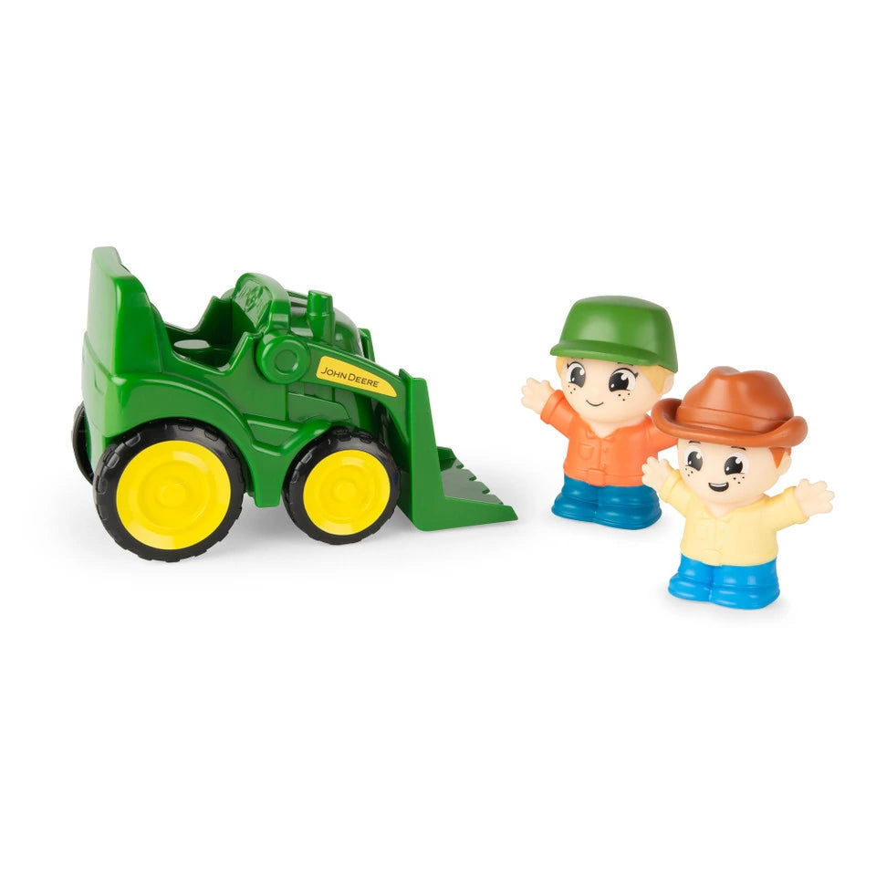 Green John Deere front loader tractor with yellow wheels beside two farm figures wearing green and brown hats on white background