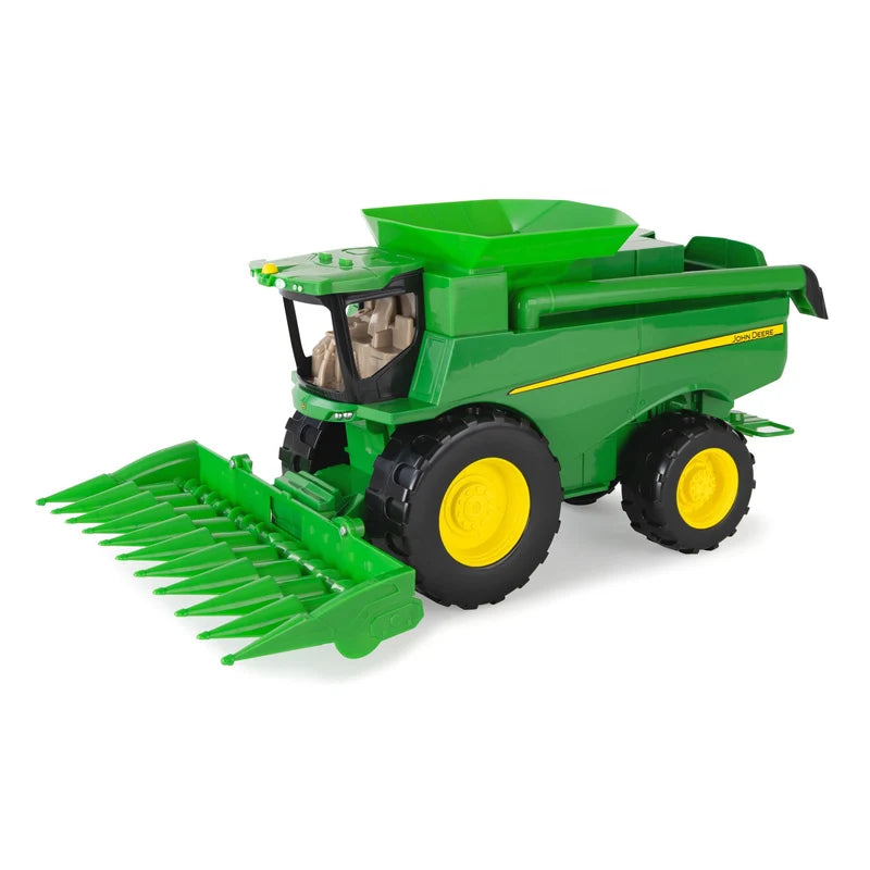 John Deere Lights & Sounds Combine 47714 front left view with green corn head fitted