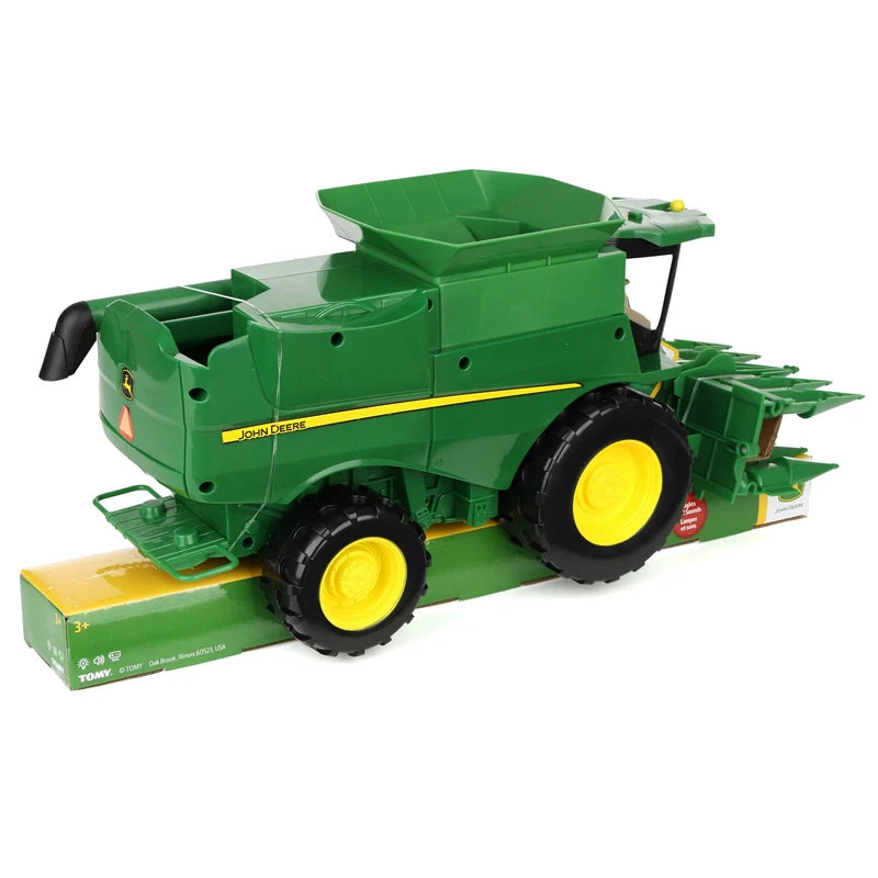 John Deere Lights & Sounds Combine 47714 rear right view secured to the retail packaging showing the body, wheels and unloading auger