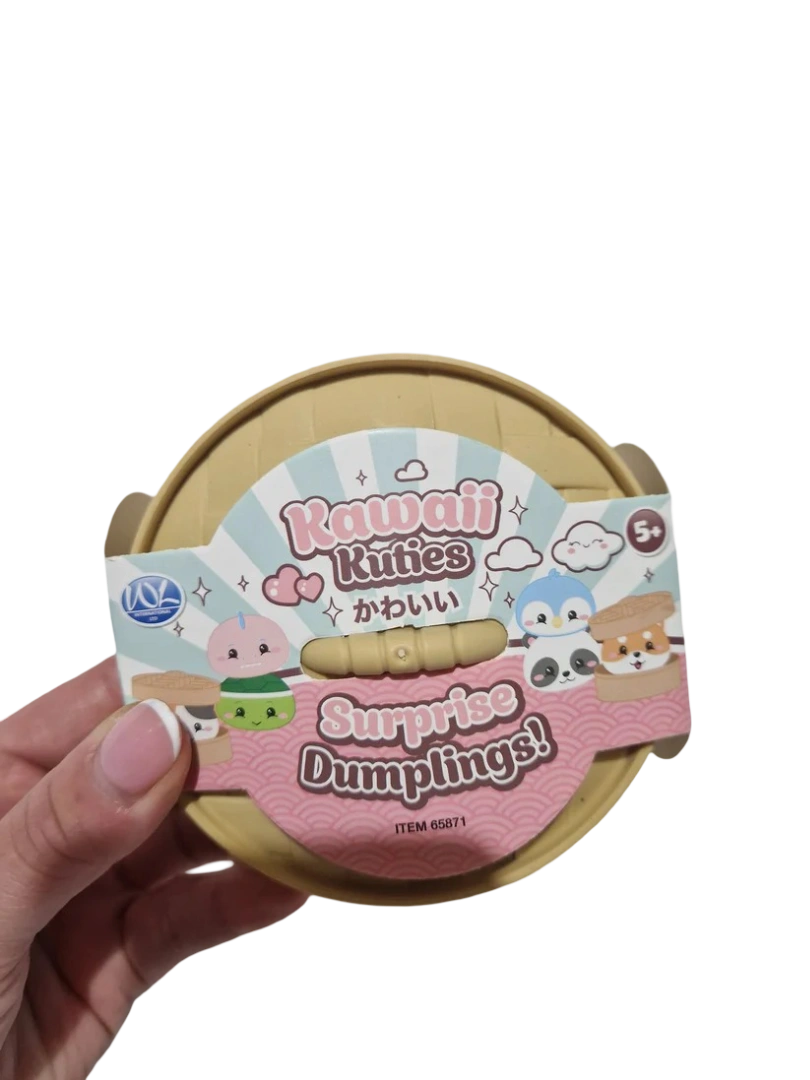 Kawaii Kuties Surprise Dumpling closed dumpling container and product sleeve held in one hand