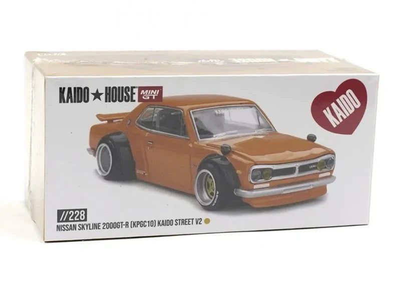 Kaido House Nissan Skyline 2000 GT-R KPGC10 Kaido Street V2 collector box showing printed Safari Gold model artwork, Kaido House and MINI GT logos and model number 228