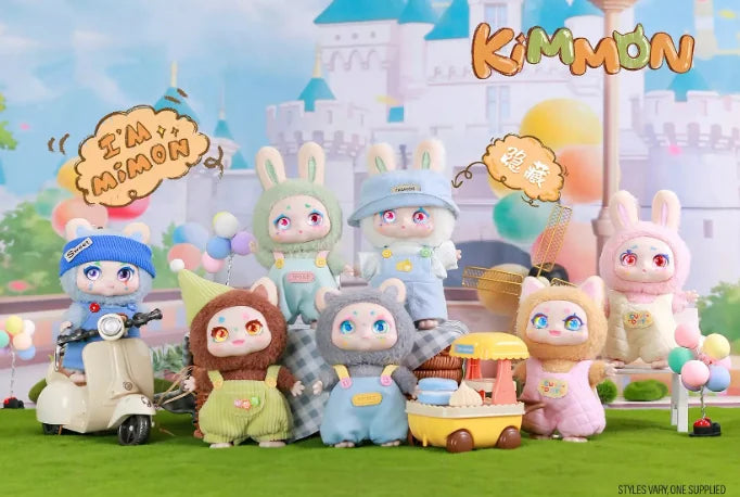 Set of Kimmon Mimon collectible plush dolls displayed together in a colourful fantasy scene with castle backdrop in Ireland