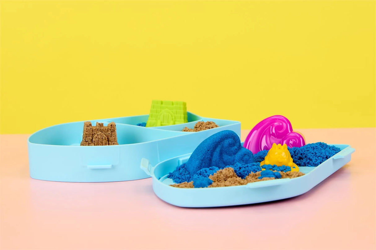 Kinetic Sand Surf N' Sand Paradise open blue case with blue and brown sand, moulds and tools