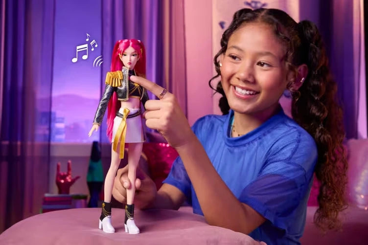 Child pressing the KPop Demon Hunters Mira Singing Doll sound button