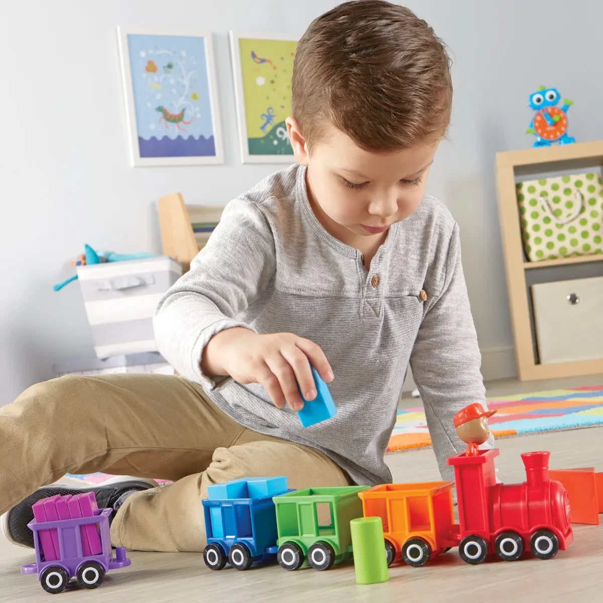 Child playing with Learning Resources Count and Colour Choo Choo