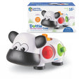 Dottie the Fine Motor Cow toy shown with packaging and colourful dots – Ireland