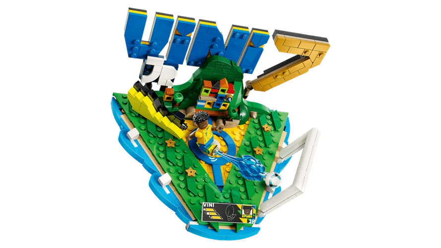 Overhead view of LEGO Editions Vini Jr. Football Highlights 43027 showing the green football display, blue VINI lettering, yellow number 7, Vini Jr. minifigure, football and signature plaque.