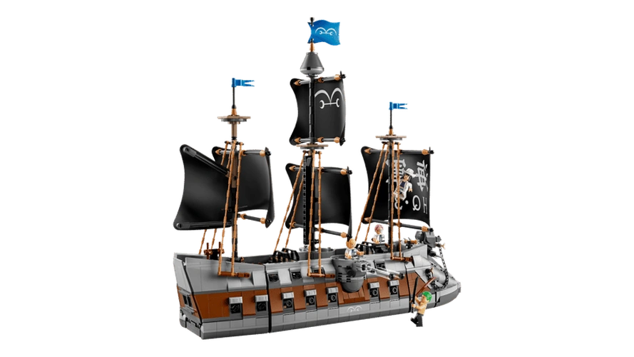 Side view of LEGO ONE PIECE Garp's Marine Battleship 75646 showing three masts with black sails, grey and brown hull, blue Marine flags, rigging and minifigures aboard the ship.