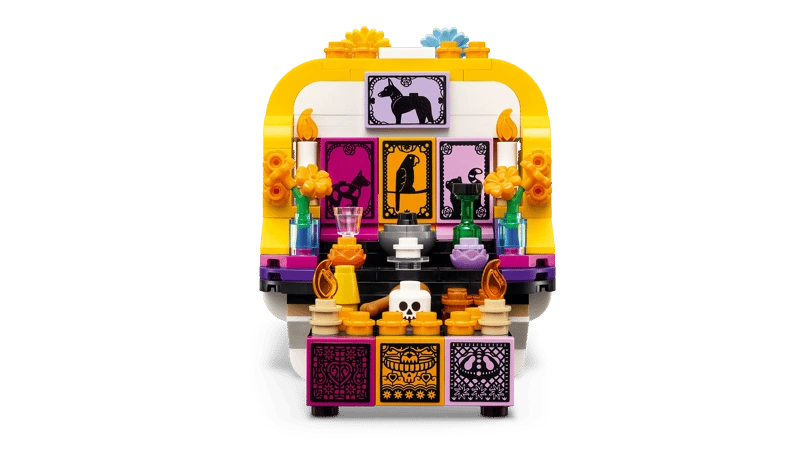 Front view of the LEGO Altar of the Dead 40811 altar side with flowers, framed pictures and food details