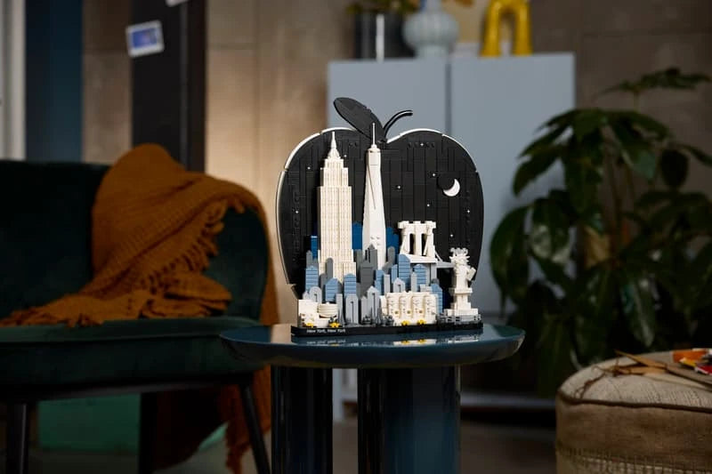 Completed LEGO Architecture New York City The Big Apple model displayed on a dark round side table in a living room