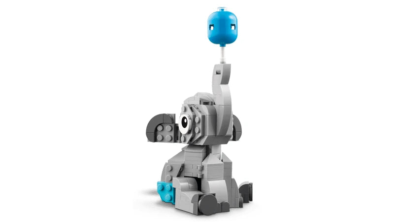 Side view of LEGO baby elephant build with blue balloon on a white background