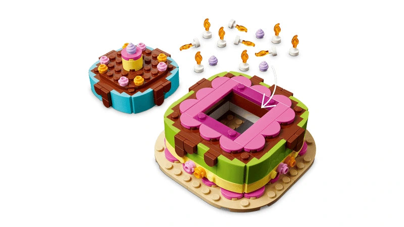 LEGO birthday cake build opened to show the storage compartment with candles and decorations above