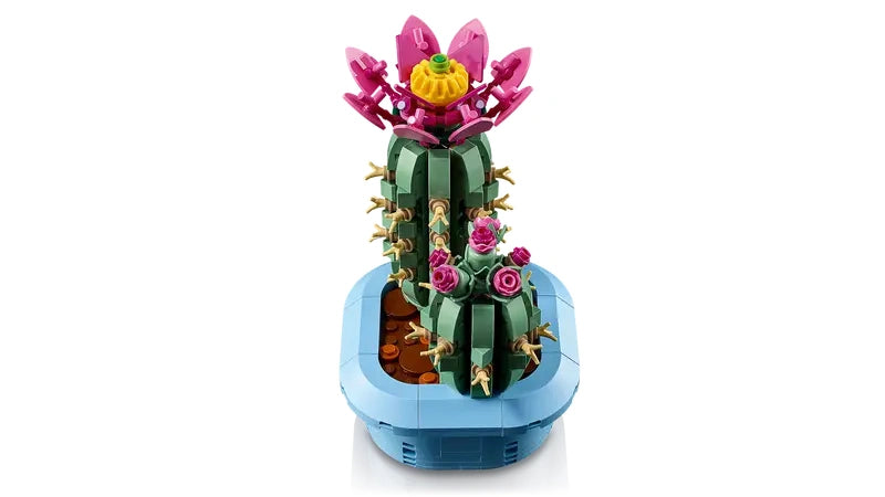 Front view of two LEGO cactus models in a light blue plant pot with a large pink flower on one cactus and pink buds on the other