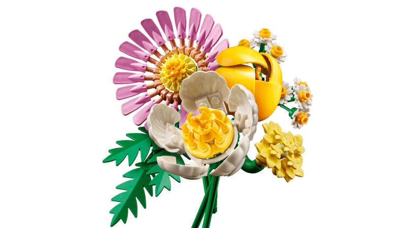 Assembled LEGO Botanicals Petite Sunny Bouquet 10347 showing pink gerbera flower, yellow tulip bud, white peony style flower, small yellow blossoms and green foliage on adjustable green stems