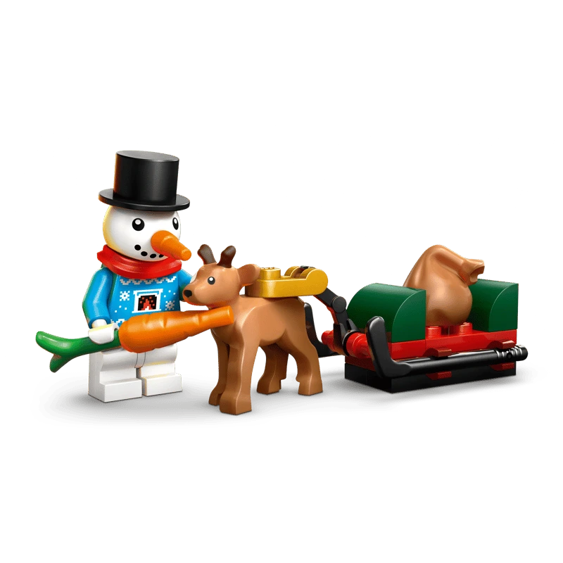LEGO snowman holding a carrot beside a baby reindeer pulling a red and green sleigh