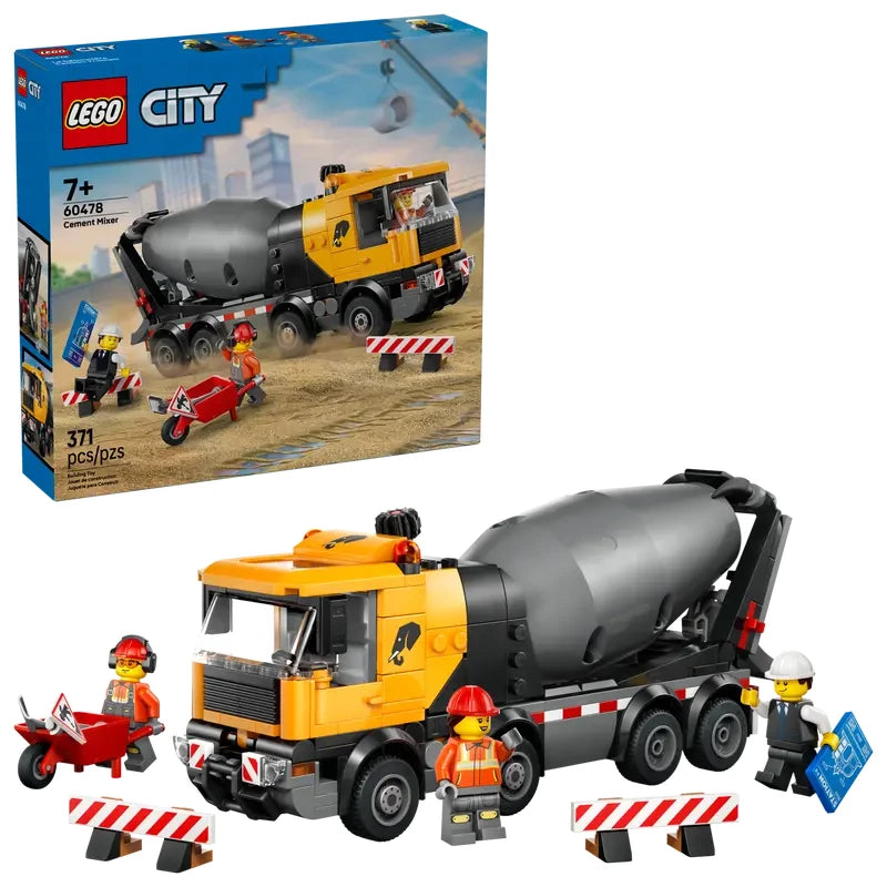 LEGO City cement mixer truck shown beside the retail box, with three construction minifigures, wheelbarrow, road barriers and road sign