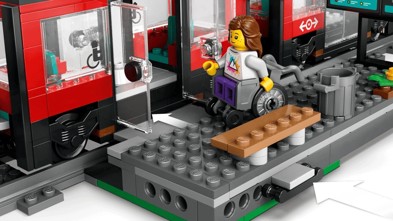 LEGO City wheelchair minifigure beside the open streetcar door on the station platform