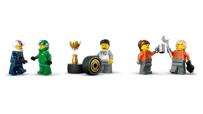 LEGO City F1 driver and race crew minifigures with trophy, tire, and tools displayed on white background