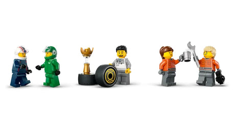 LEGO City F1 driver and race crew minifigures with trophy, tire, and tools displayed on white background