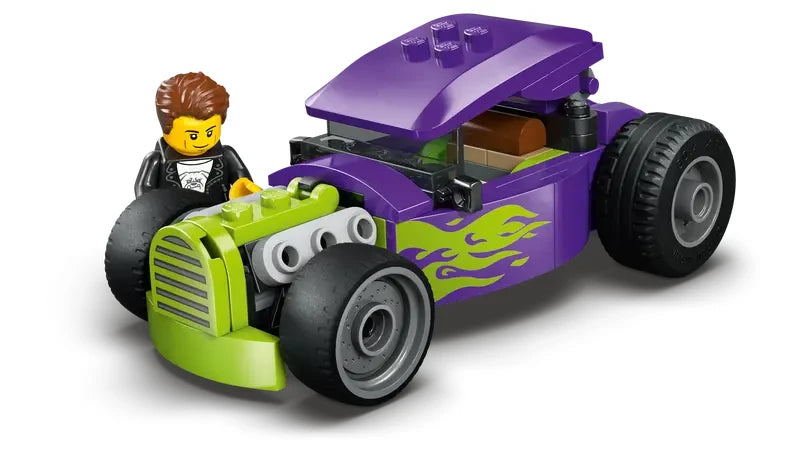 LEGO City Hot Rod purple and green vehicle shown with a minifigure standing next to the front left side of the car