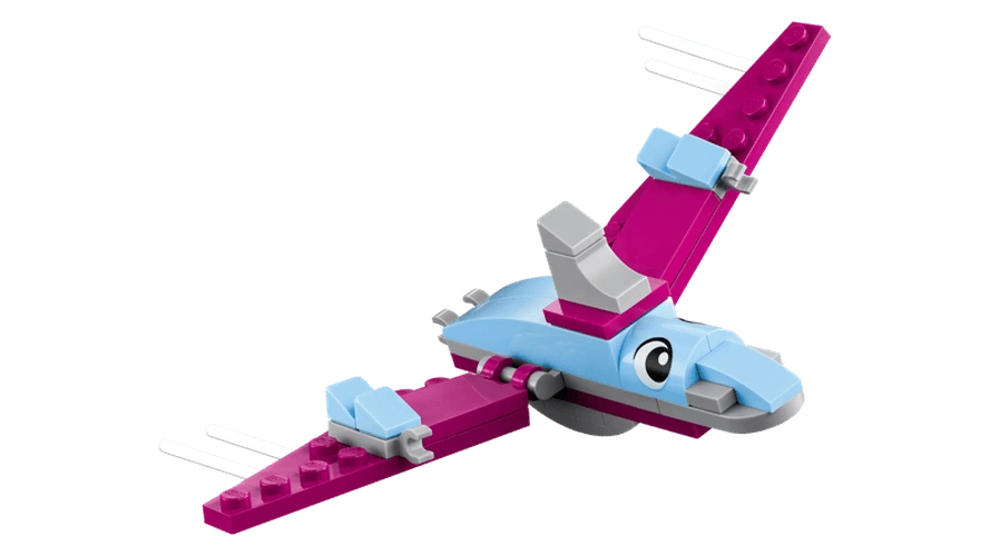 Close-up of pink flying dinosaur from LEGO Classic Creative Dinosaurs 11041 with outstretched wings, large eyes and white curved details