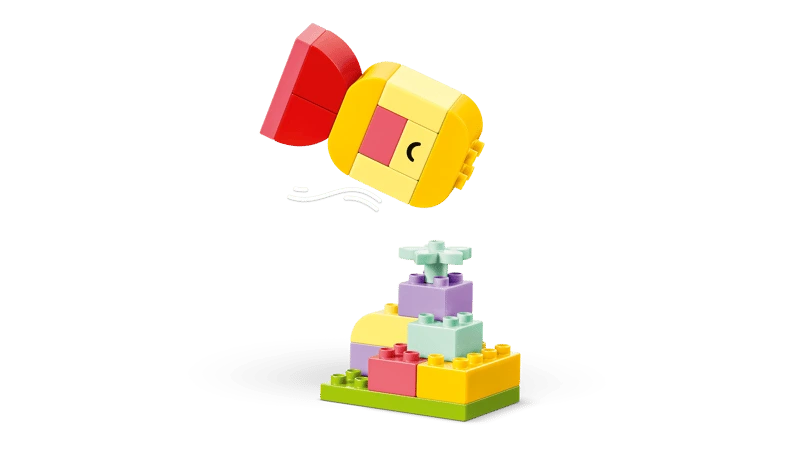 LEGO DUPLO spinning top build above a small flower base build