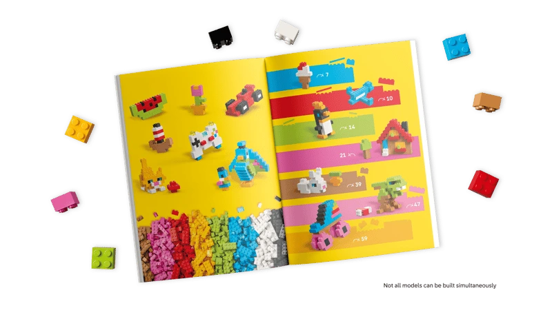 LEGO building instructions booklet with loose bricks around it