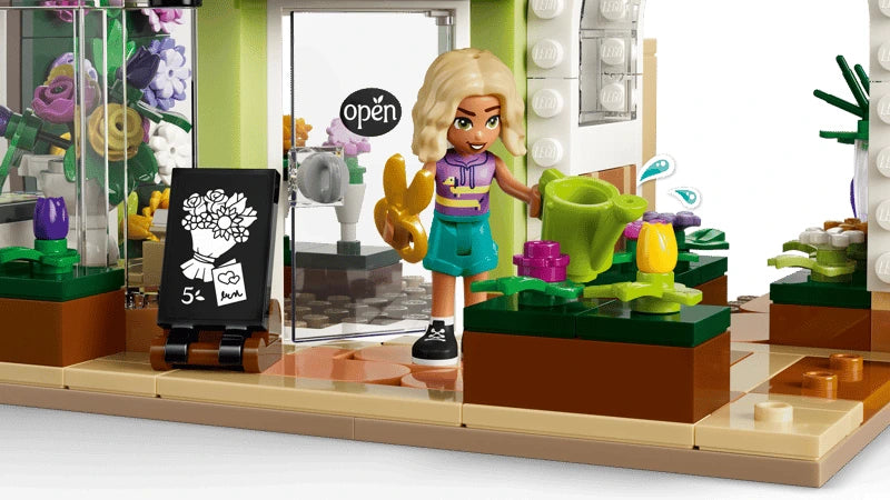 LEGO Friends flower shop interior with Nova mini-doll, watering can, flowers and shop sign