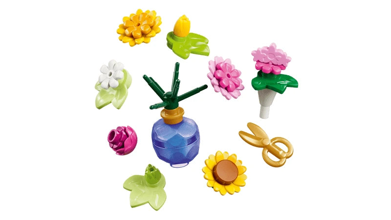 LEGO flower pieces with vase and gold scissors