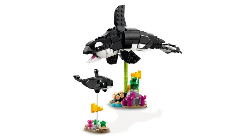 LEGO Creator 3 in 1 orca and calf figures from Wild Animals Panda Family set with coral display on white background