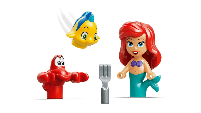 Ariel figure with red hair and teal tail shown with Flounder and Sebastian figures and small accessories on a white background