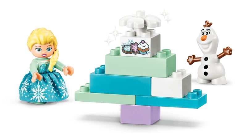 LEGO DUPLO Elsa and Olaf beside a stepped Frozen cake build with snowflake detail