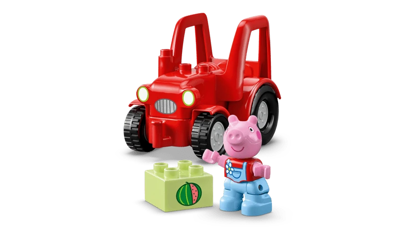 Red LEGO DUPLO tractor with black wheels carrying Peppa Pig figure and light green brick printed with a watermelon slice