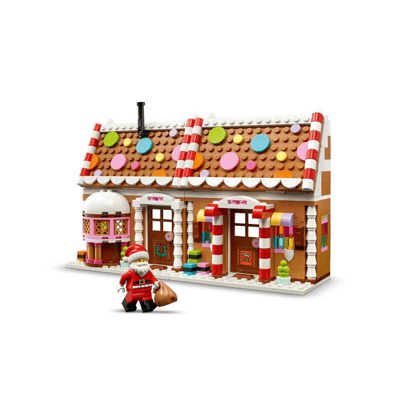 LEGO Festive Gingerbread House 40809 front view with Santa minifigure beside the decorated house