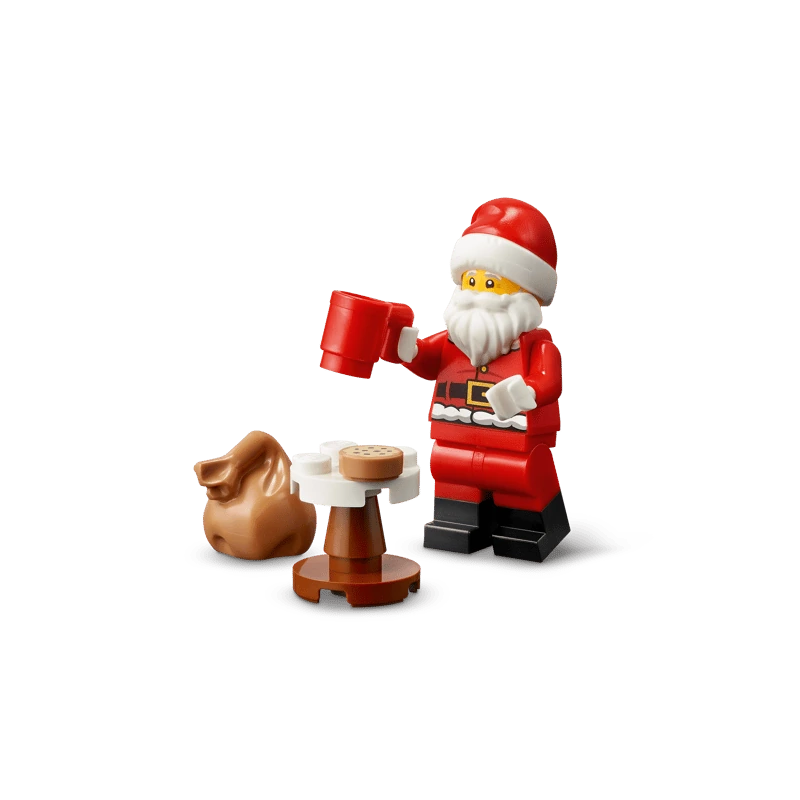 LEGO Santa minifigure holding a red mug beside a small table and brown sack