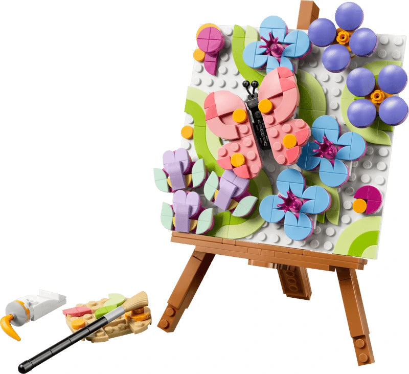 LEGO floral easel painting with butterfly, blue flowers, purple flowers, brush and palette