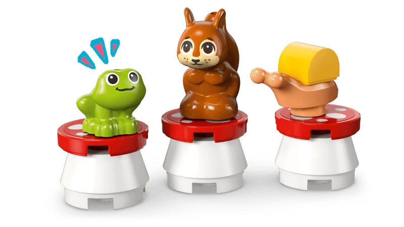 LEGO frog and squirrel figures on round seats beside a small turntable build