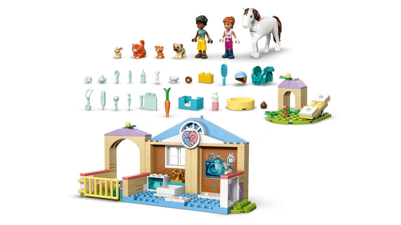 LEGO Friends Animal Vet Clinic pieces laid out showing minidolls, horse, dog, bunny, cats, accessories and build sections arranged above the clinic