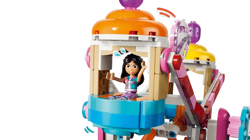 LEGO Friends minidoll seated inside a colourful Ferris wheel carriage