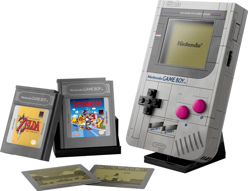 LEGO Nintendo Game Boy model on display stand with two interchangeable game cartridges, The Legend of Zelda and Super Mario Land, plus two screen display pieces in front