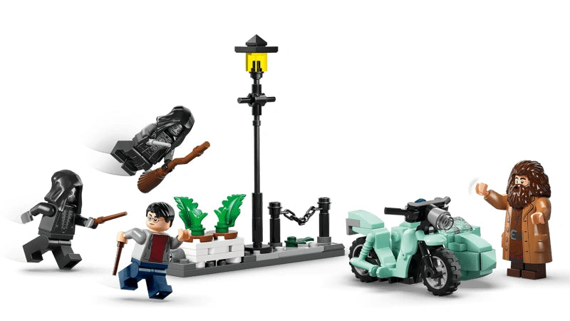 Assembled LEGO Privet Drive street scene with lamppost and planter, Harry Potter minifigure, two Death Eater minifigures and Hagrid’s flying motorcycle with sidecar