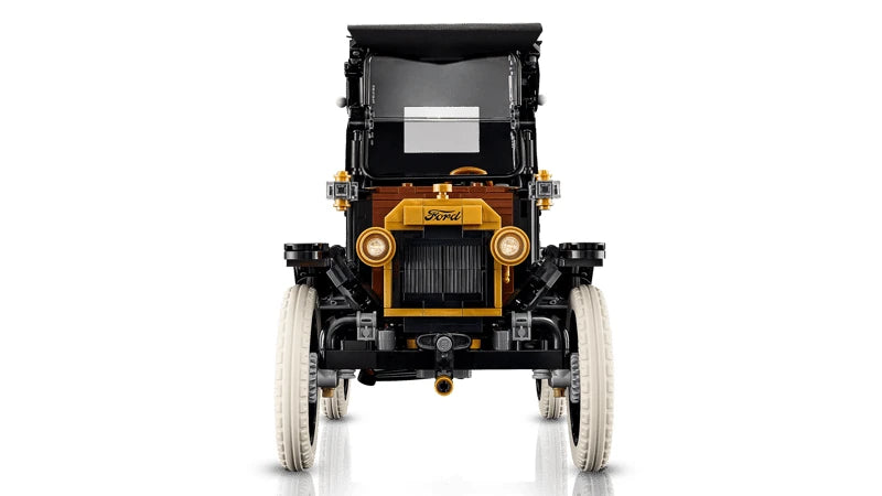 Front view of the LEGO Icons Ford Model T with gold radiator surround, round headlights, split windscreen and white tyres